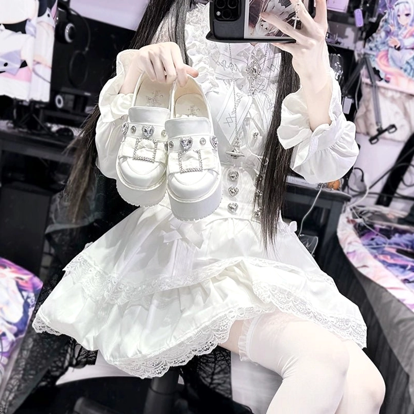 White glossy Jirai Kei platform loafers showing high-shine finish and dramatic height presence