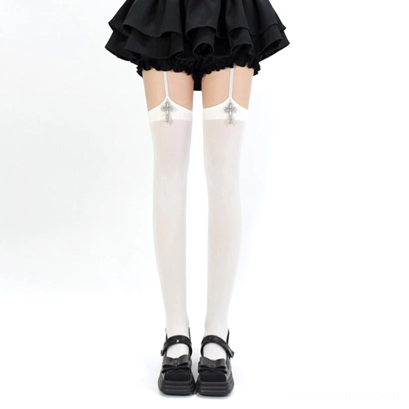 Pure white Gothic cross pendant Jirai Kei garter thigh-high stockings with silver cross pendants displayed on model in black ruffle skirt front view aesthetic