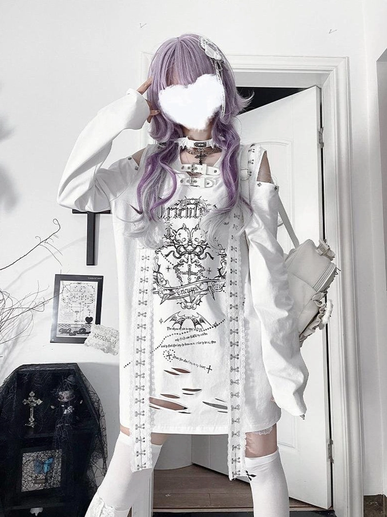 White goth long-sleeve tee with ripped hemline and cut-out shoulders worn by alternative model with purple hair, showcasing minimalist dark aesthetic and layered jewelry styling