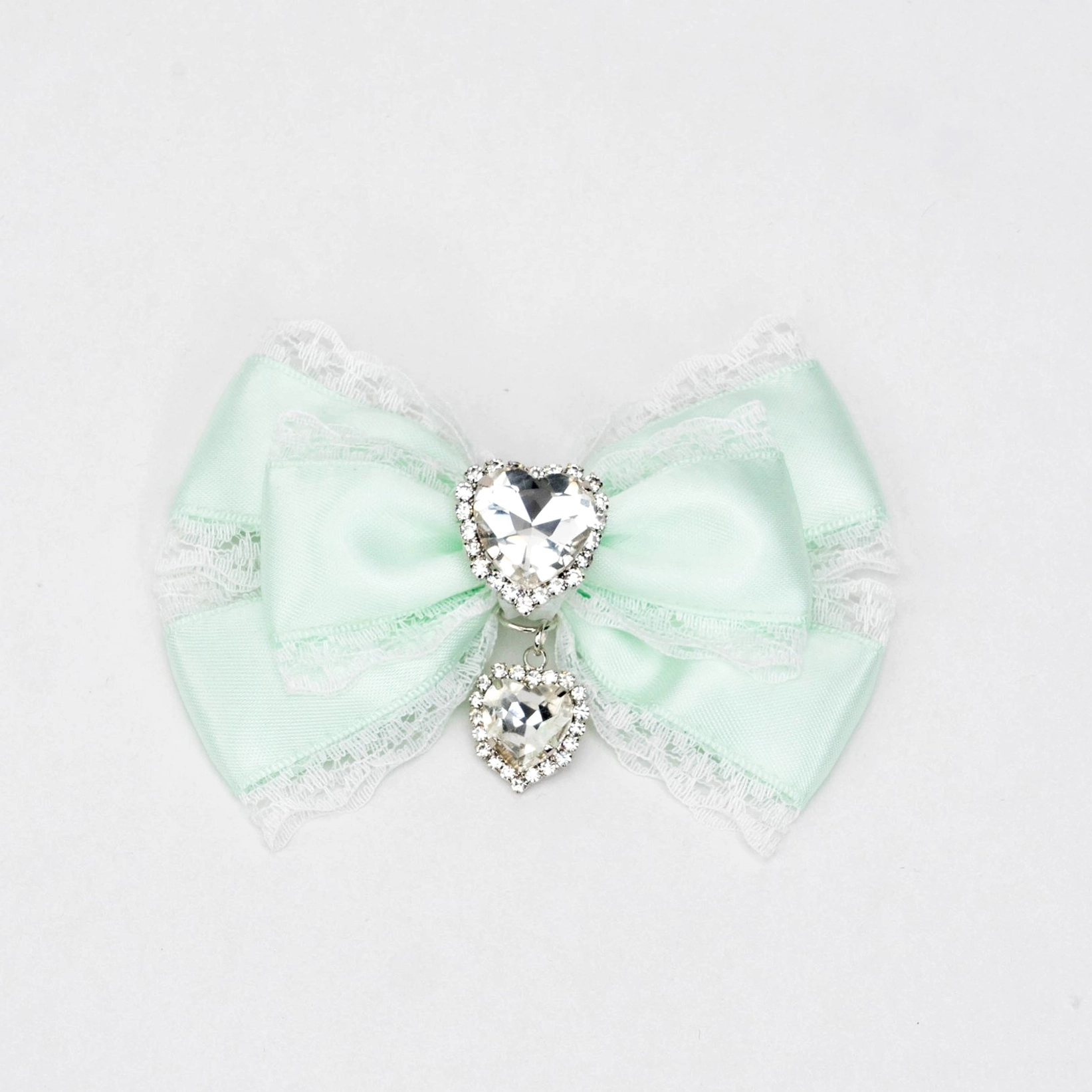 white and green jirai kei bow hair clip green satin with white lace trim heart rhinestone dangling detail