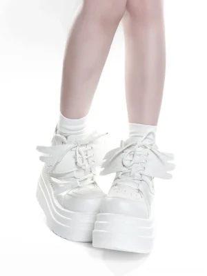 All-white high-top platform sneakers with smooth PU leather upper, lace-up design, and removable wing decorations, front perspective