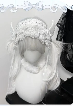 White angel wing Jirai Kei lace hairband front close-up view on mannequin with white twin ponytails showcasing ruffled lace trim fabric rose accent and angel wing decorations
