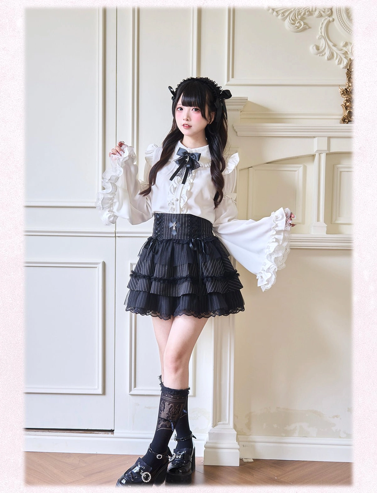 White Jirai Kei blouse with detachable bell sleeves and black decorative bow tie collar featuring lace trim and peter pan collar detail