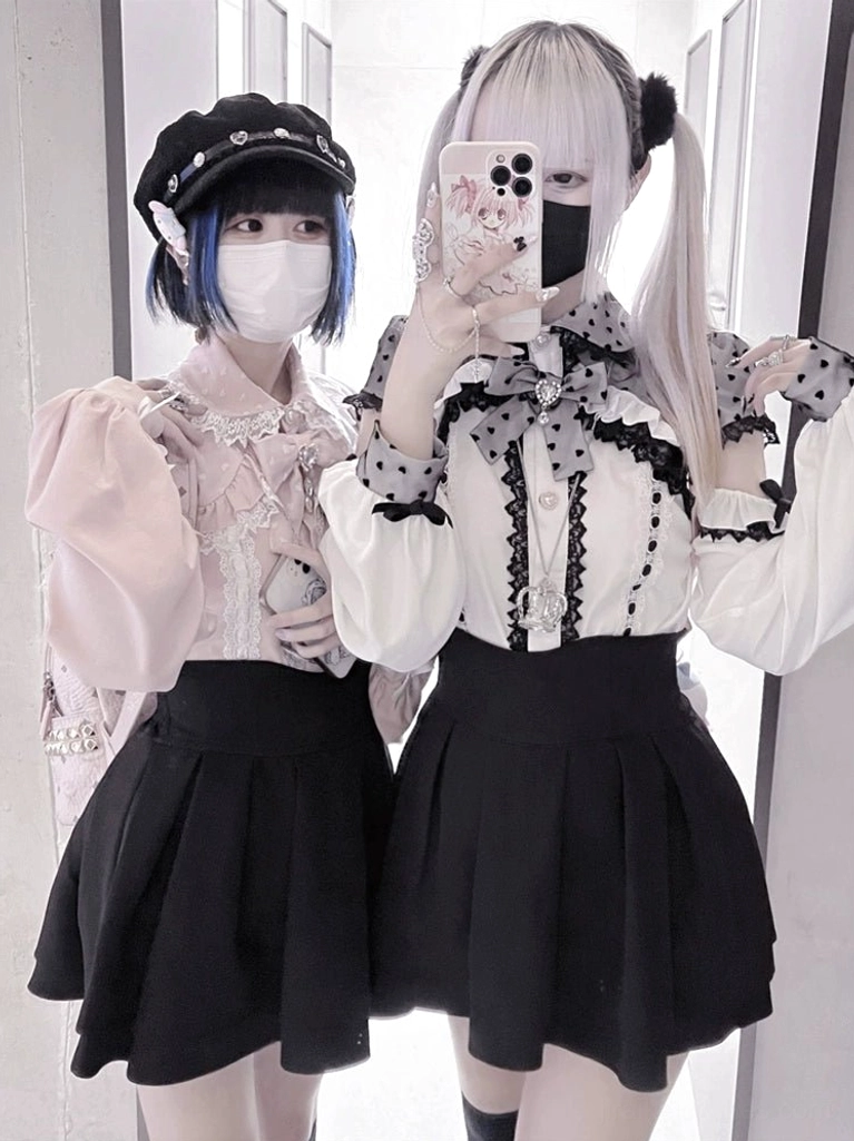 White jirai kei blouse off-shoulder design with heart polka dots worn as sweet aesthetic piece
