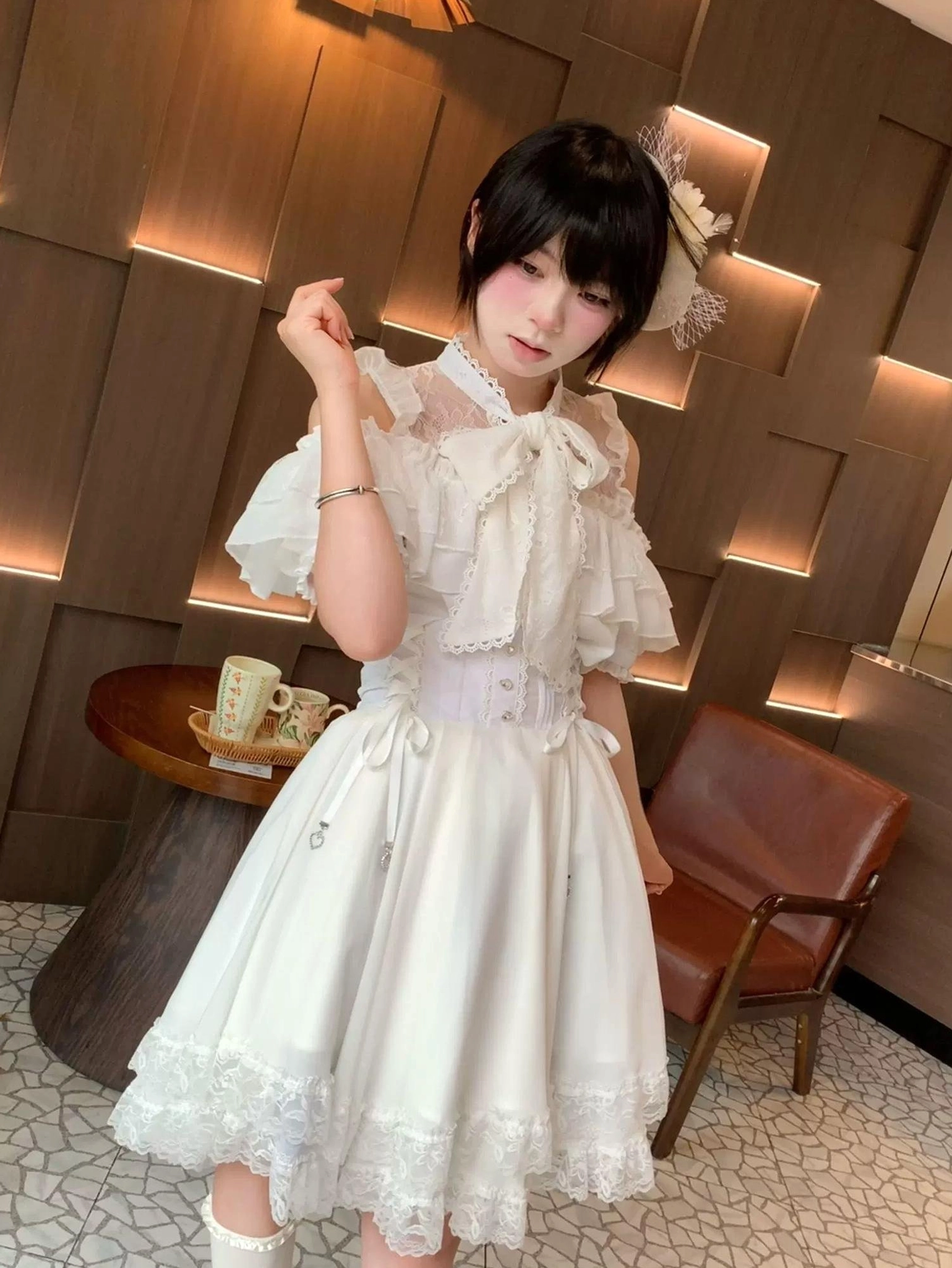 White off-shoulder ruffle short sleeve Jirai Kei blouse front eye-level view with corset-style waistband