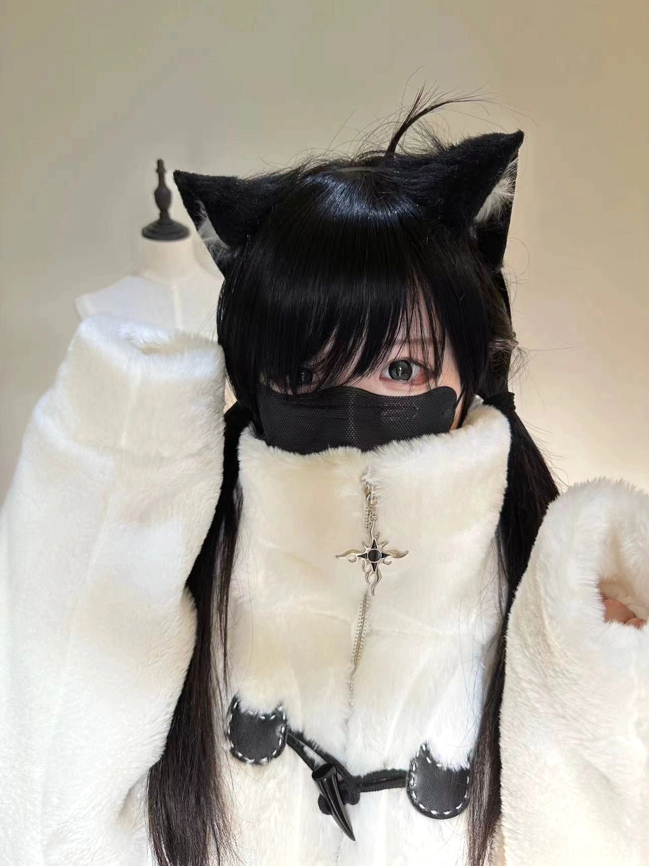 White fuzzy cat ear coat close-up selfie front view black-haired girl face mask cat-shaped toggle fasteners high collar
