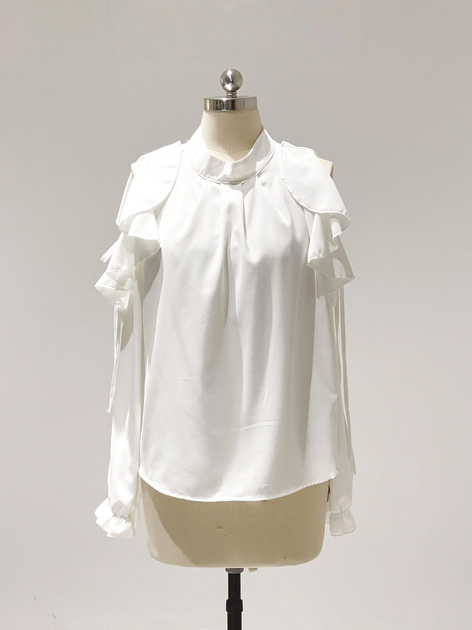 White elegant cold-shoulder ruffled chiffon blouse Jirai Kei aesthetic loose fit front view mannequin