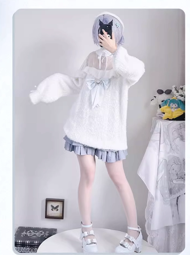 Cropped white fuzzy sweater top on model with light purple hair, paired with light blue pleated skirt, full-body front standing view