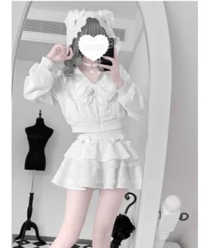 White two-piece Jirai Kei outfit with lace bow decoration and elastic waistband skirt, model wearing lace headband and choker, front mirror view of complete ensemble