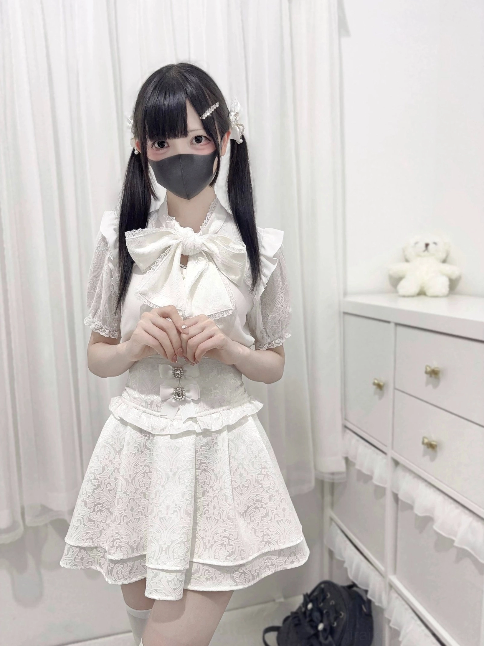 White jirai kei lace bow blouse front standing full body view hands folded ruffled collar lace sleeve trim frill cuffs