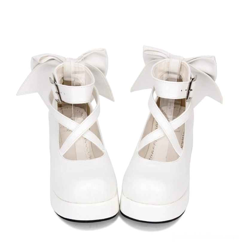 White Lolita platform Mary Janes with big bow detail and secured crisscross ankle strap with square metal buckle, front view