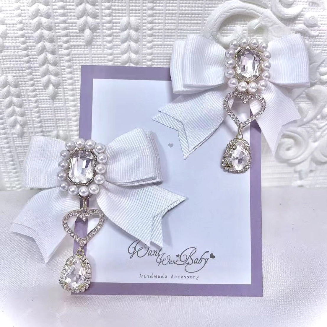 White Jirai Kei pearl rhinestone bow hair clips carded display with sparkly rhinestone pearl center and delicate teardrop charm pendant
