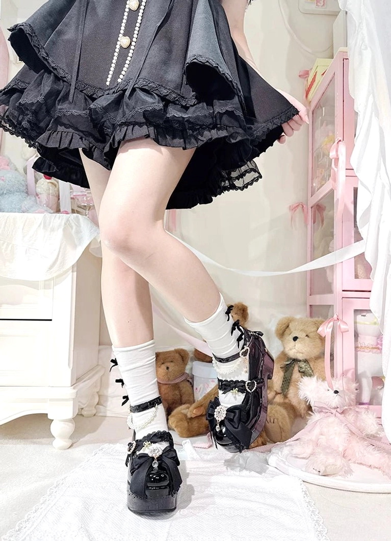 White Jirai Kei platform Lolita shoes close-up embellishments rhinestone bow lace-up heel decoration