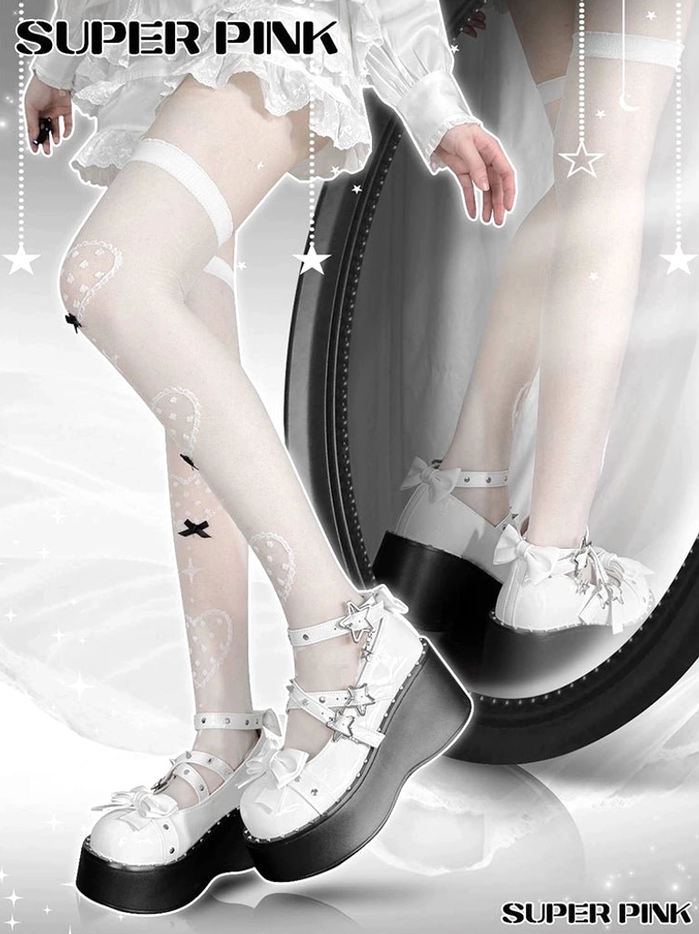 White patent leather Jirai Kei platform Mary Jane shoes worn by model in ruffled white outfit, front low angle leg view with bow accents and star buckle straps visible