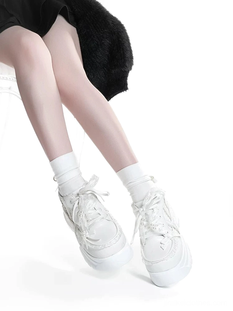 White Jirai Kei platform shoes three-quarter angle view showcasing full design including lace trim pearl accents and platform sole profile