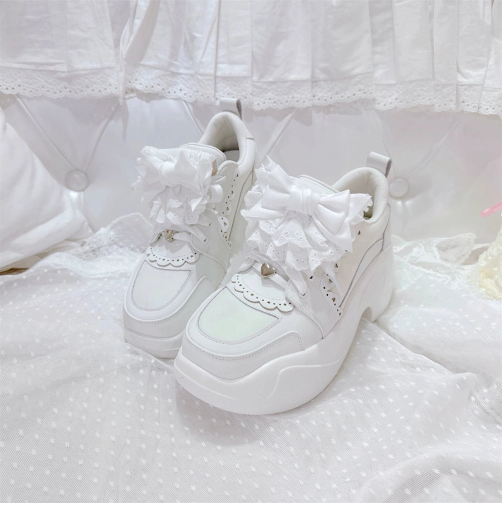 White Jirai Kei platform sneakers main product shot pristine white finish lace bow ruffle trim chunky seven centimeter platform heel