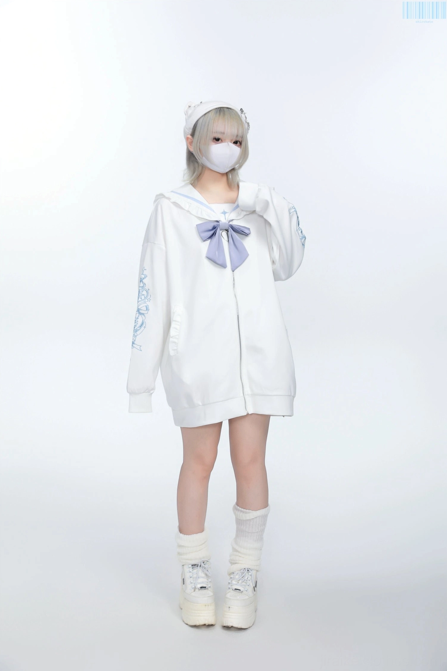 Three-quarter view white Jirai Kei sailor jacket with light purple embroidery, bow detail, and structured sailor collar design