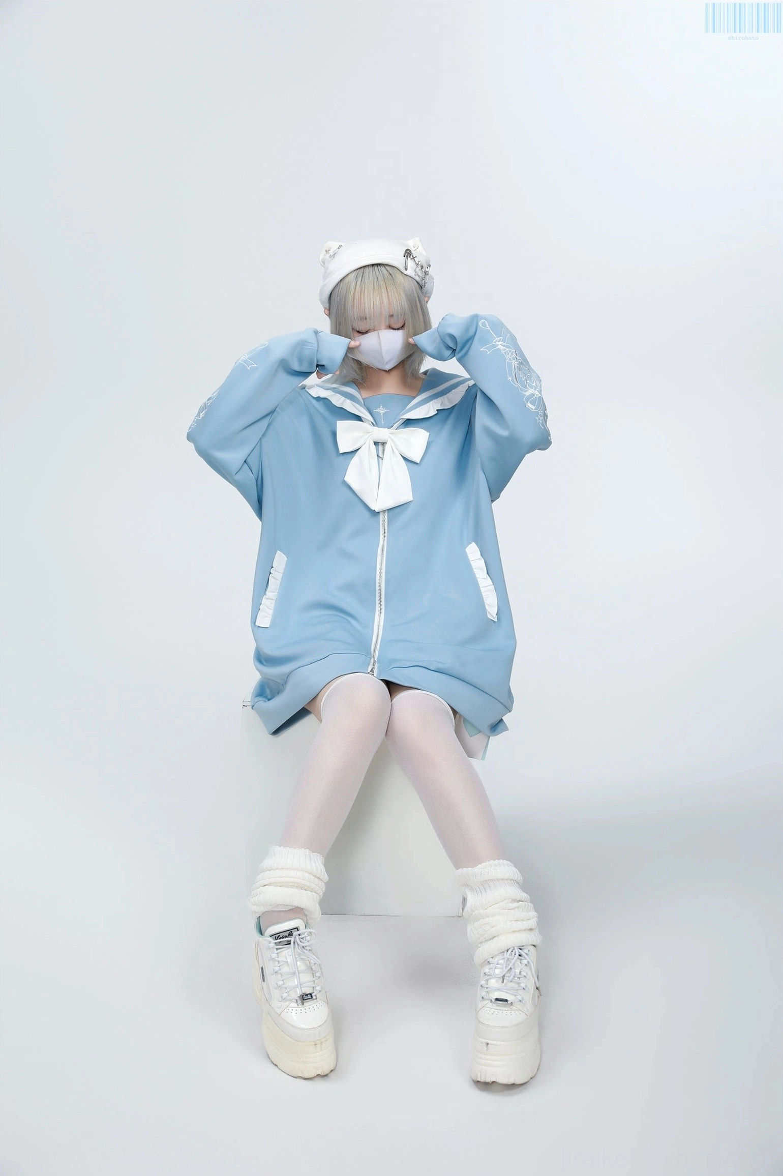 White Jirai Kei sailor jacket with light purple bow and embroidered sleeve details, full-length outfit coordination