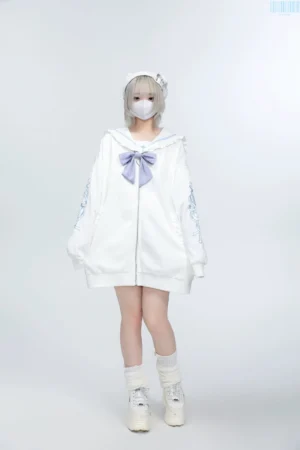 White Jirai Kei sailor collar embroidered zip jacket with light purple bow and sleeve embroidery, worn by light gray-haired model in studio