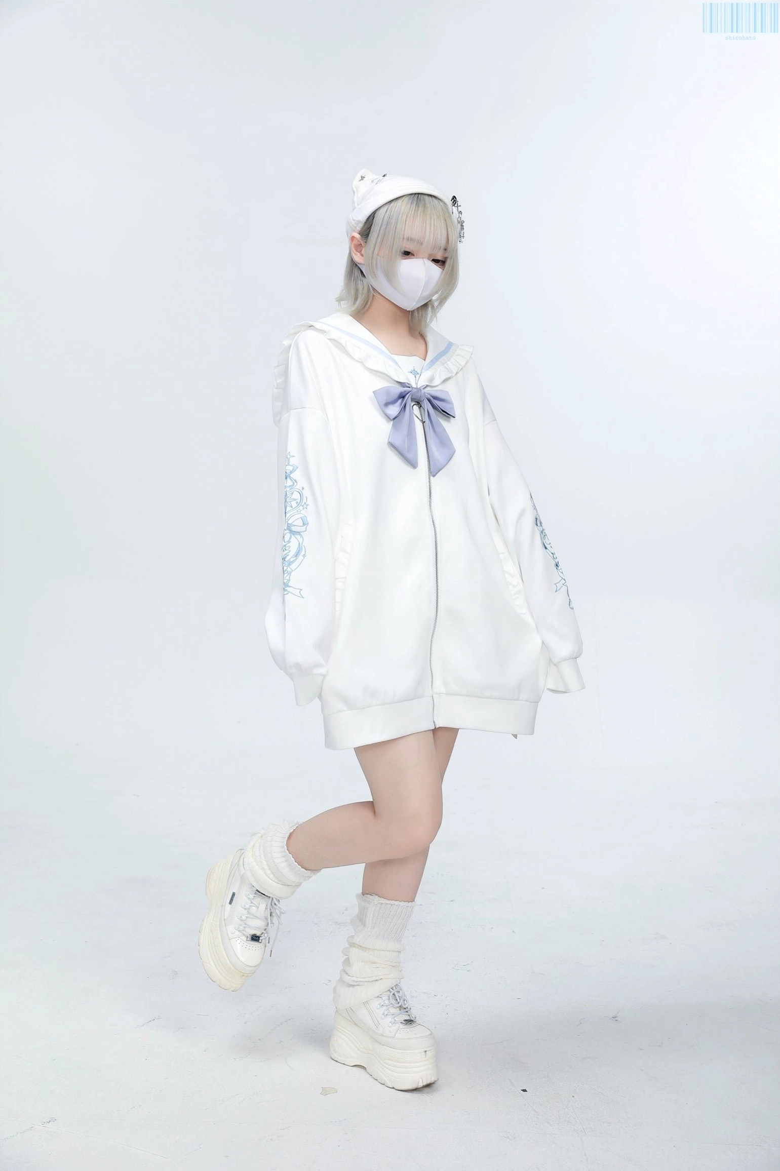 Side view white Jirai Kei sailor jacket with light purple bow and sleeve embroidery, model wearing platform loafers