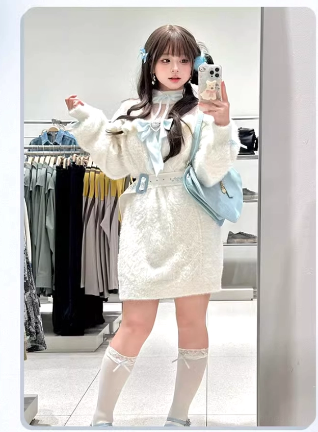 Side profile view of white fuzzy Jirai Kei sweater showing silhouette, sleeve detail, and tulle paneling construction