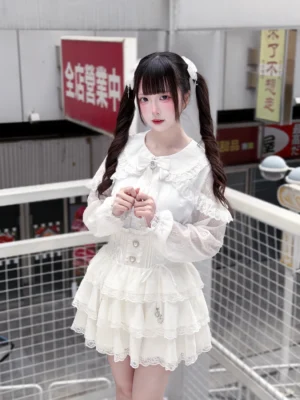 Pure white Jirai Kei outfit front close-up showing heart button details and bow collar accent