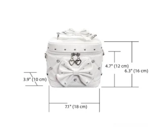 White vanity box handbag front view with bow, double heart locks and rivet trims rhinestone embellishments static product shot
