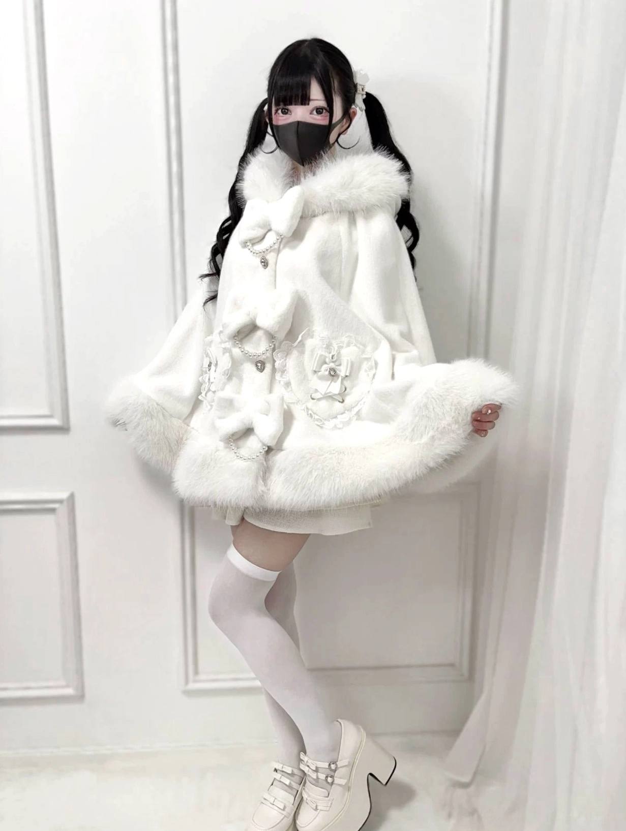 White Jirai Kei winter cape side three-quarter view with faux fur hem and floral embroidery details
