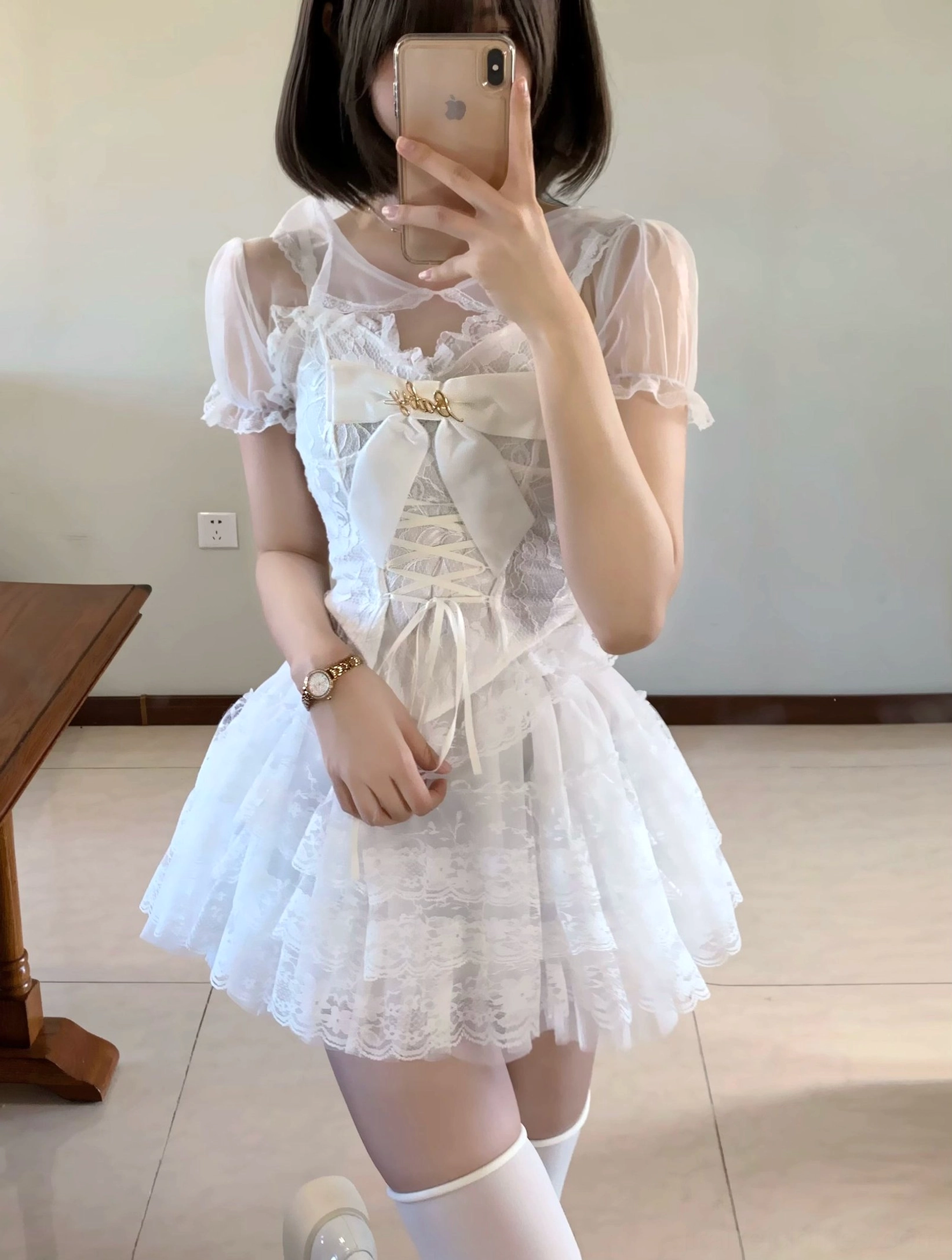 White Jirai Kei Y2K lace dress set front mirror view with sheer puff sleeves corset lace-up layered mini skirt and thigh-high socks