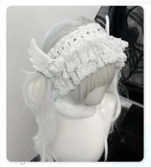 White gothic lolita Jirai Kei hairband side three-quarter angle view displaying layered ruffled lace small stud embellishments and satin ribbon straps on mannequin