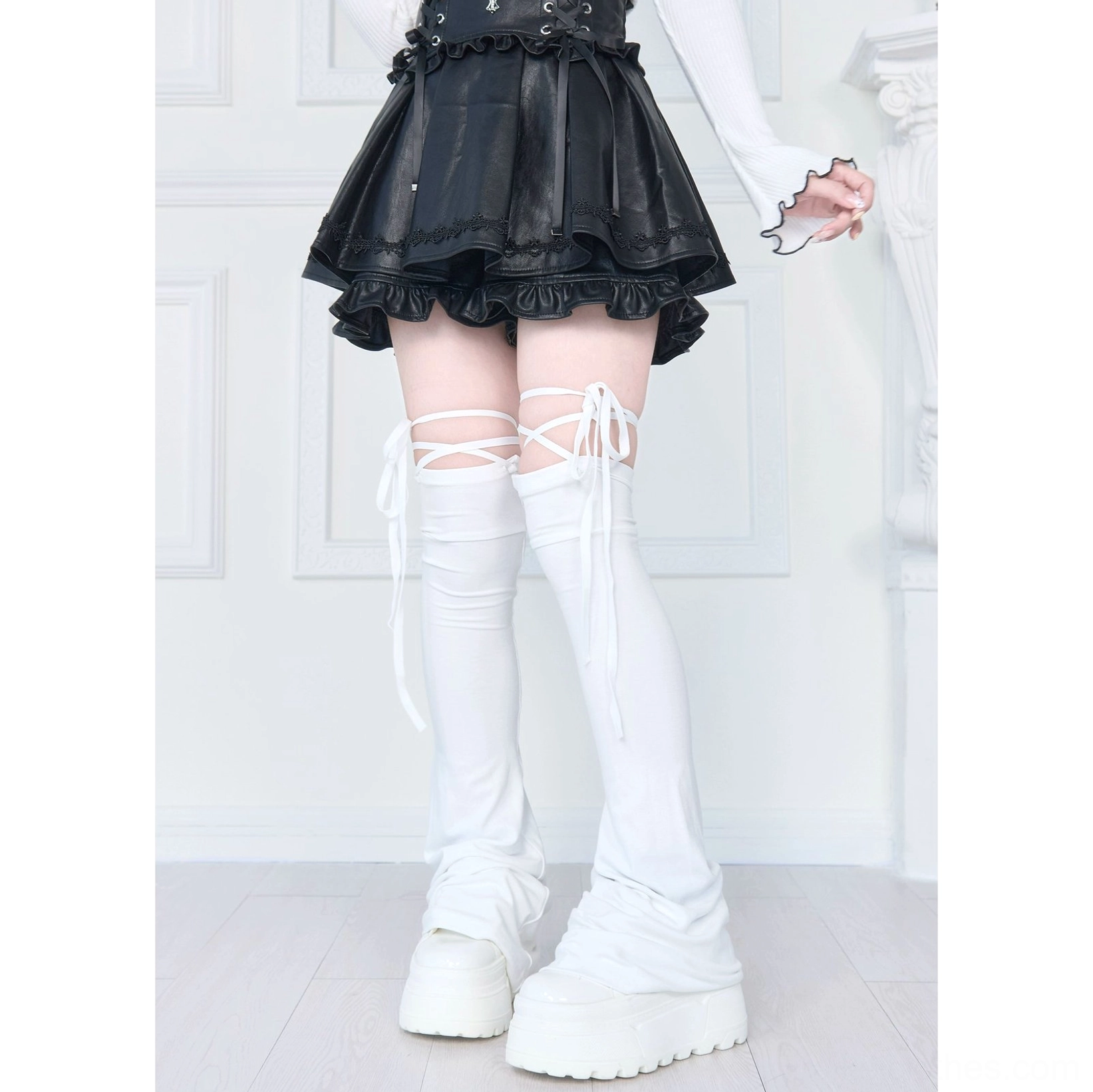 White lace-up thigh-high leg warmers front flat view with slouchy flared cuffs and lace-up ties at thigh in gothic matching outfit
