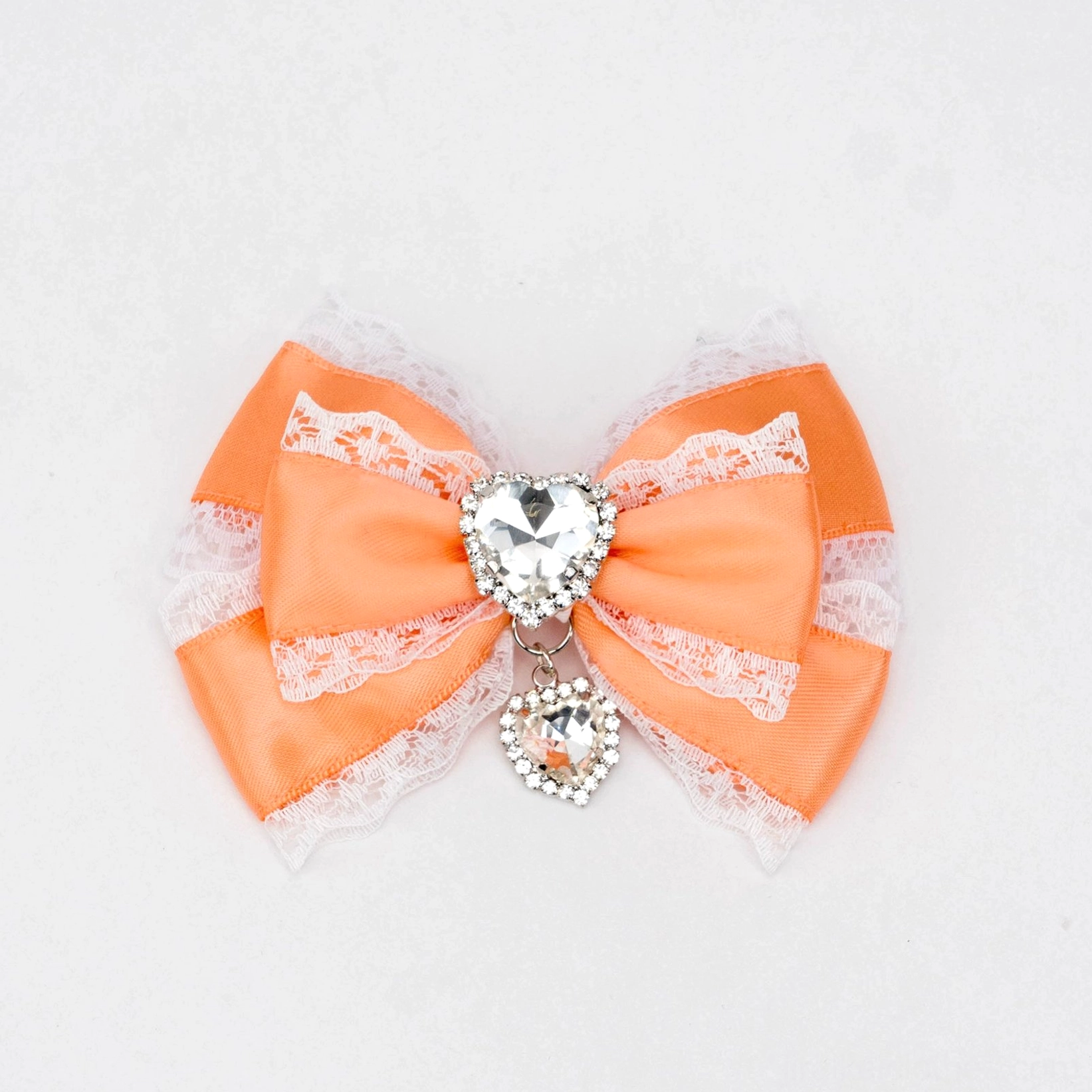 white and orange jirai kei bow hair clip orange satin with white lace trim heart rhinestone dangling charm