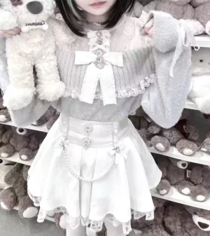 White pearl chain skirt with Jirai Kei aesthetic fluffy knit top lace bow details ruffled pleated skirt front view