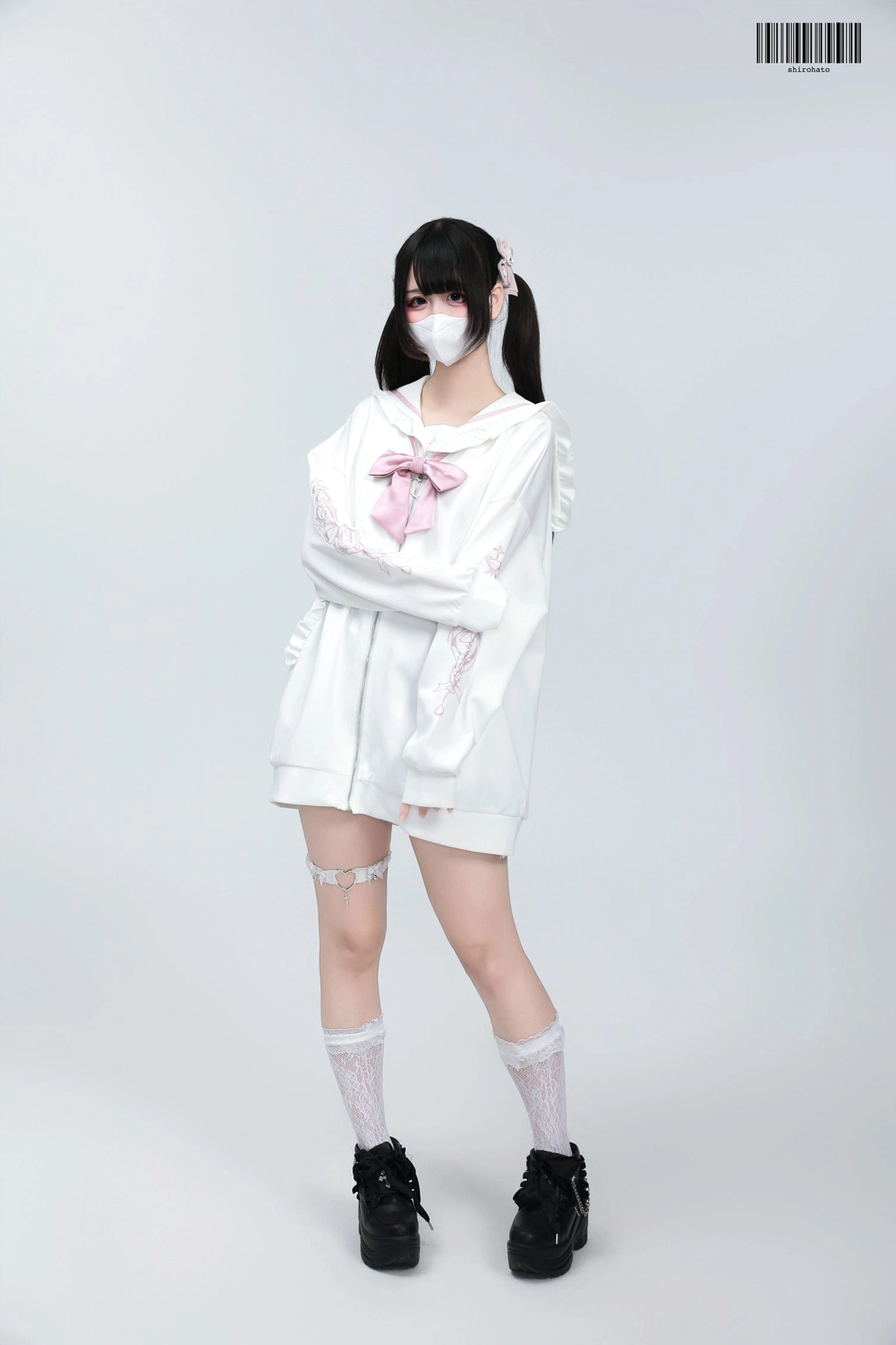 White-pink Jirai Kei sailor jacket with pink bow and embroidery details, model wearing complete Jirai Kei coordinate