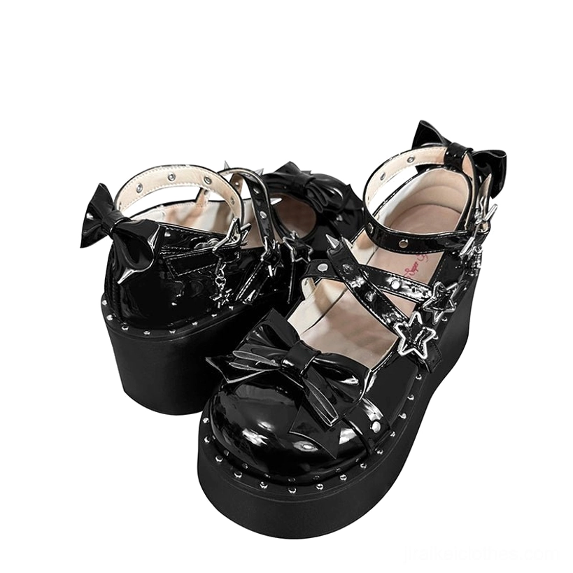White platform Mary Jane shoes material and hardware detail close-up, showcasing patent leather finish, star buckles, and bow accent construction