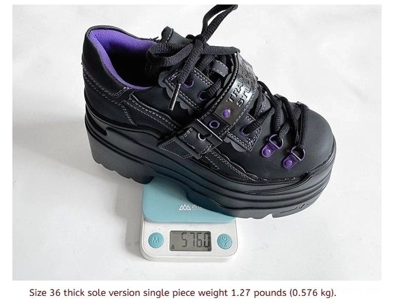 Black Y2K jirai kei platform shoes single shoe on digital scale showing weight approximately 1.27 lbs, purple lining and strap visible