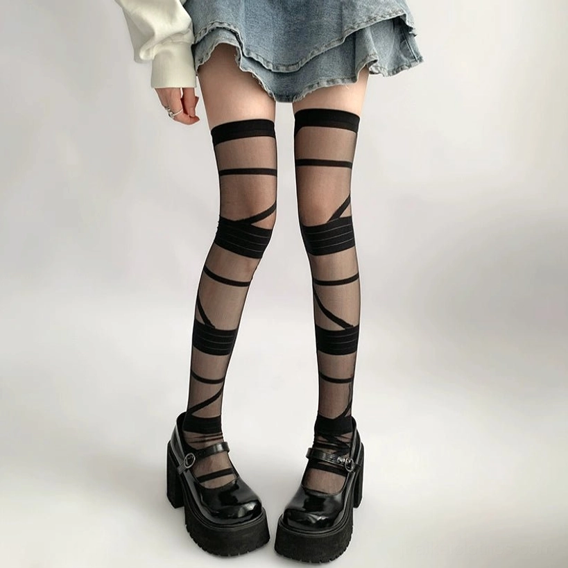 Y2K strappy thigh-high sheer socks detailed strap construction showing bandage crisscross technique and sheer polyester material quality