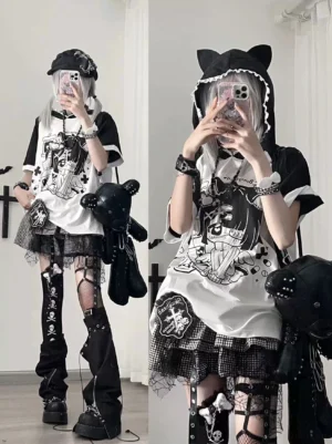 Two otaku girls wearing black and cyan yami kawaii cat ear hooded anime graphic tees with loose raglan sleeves, full-length mirror selfie showing complete subculture outfit styling